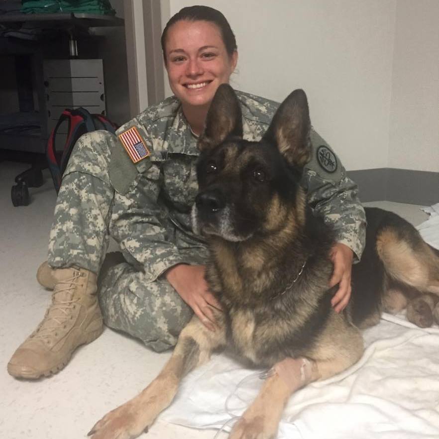 Samantha Warner and a military working dog.