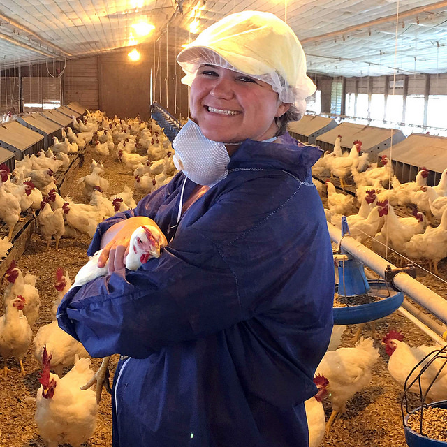 Maggie Thompson in a poultry house
