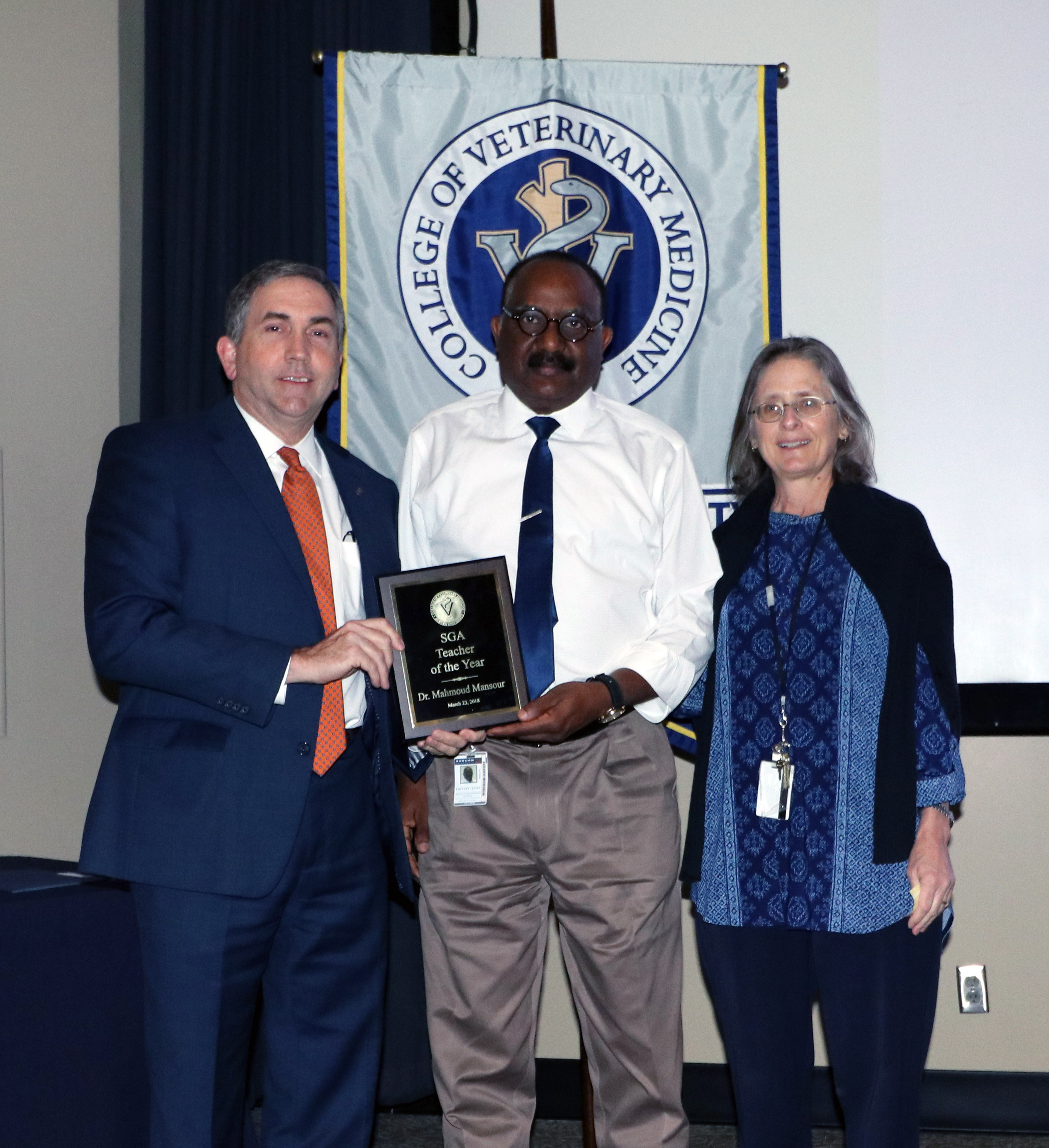Dean Johnson, Dr. Mansour and Dr. Elaine Coleman, who presented the award.