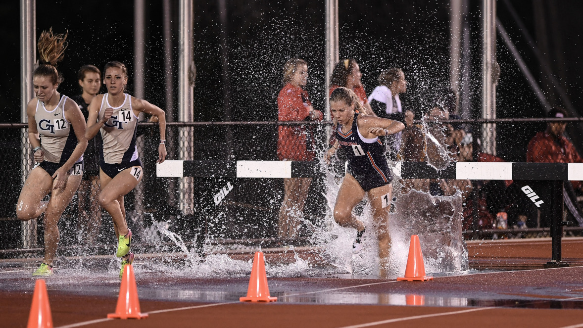 After clearing the hurdle, Amy Hansen navigates the water pit. Photo: Dakota Sumpter/Auburn Athletics