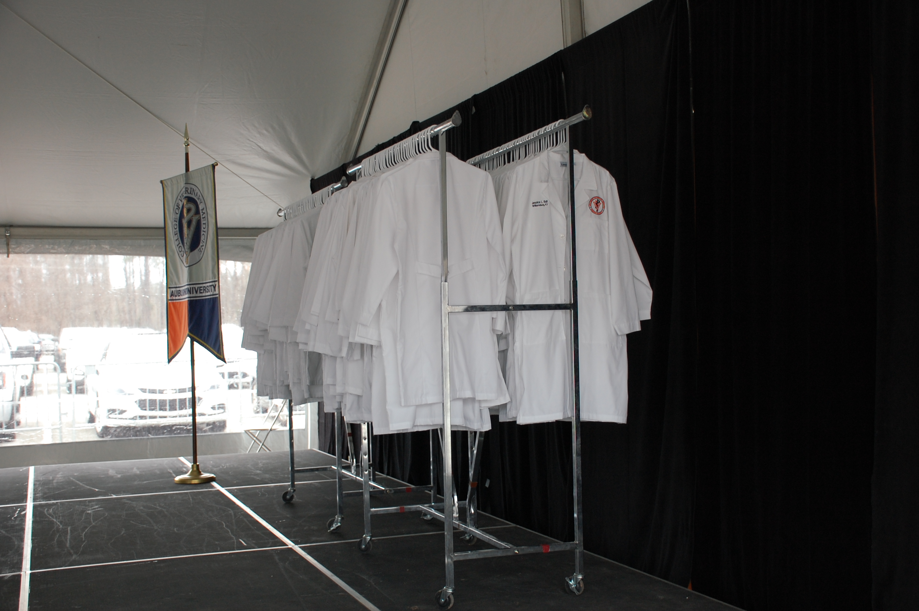 veterinary medicine white coats hanging on a rack