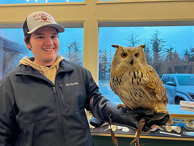 Gabe holding an eagle