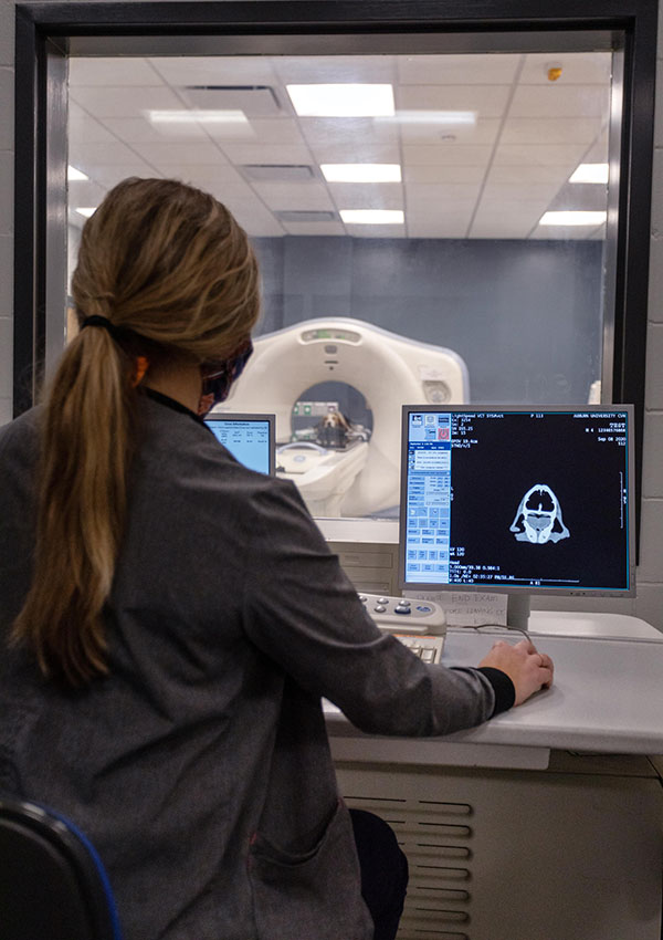 Technician monitoring MRI machine
