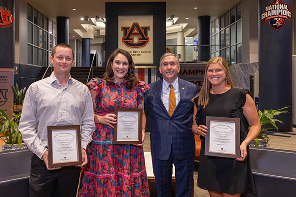 Pictured from left to right are Drs. Jarrod Miller, Beth Anne Frost, College of Veterinary Medicine Dean Calvin Johnson, and Lauren Mirus.