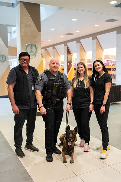 Dredd and his care team and Deputy Cavender