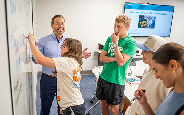 Dr. DeLuca with students